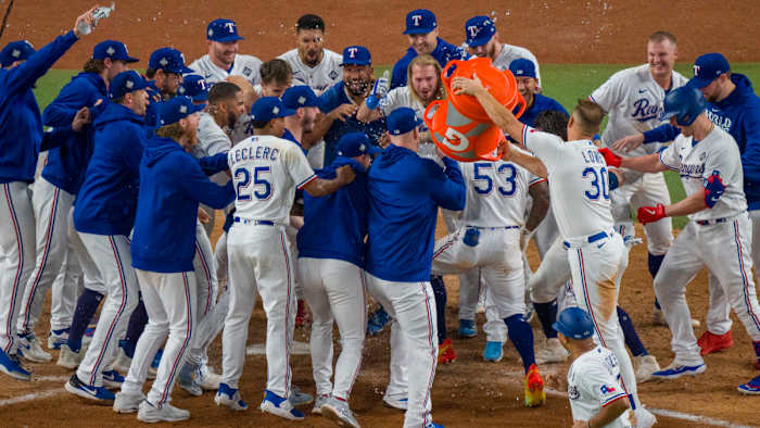 The Texas Rangers celebrate their Game 1 World Series win.